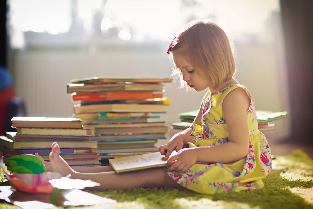 Girl reading book alone